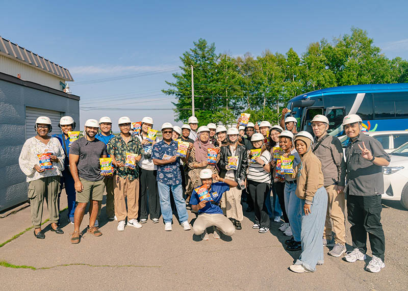 Group photo outside the Calbee factory in Hokkaido, Japan