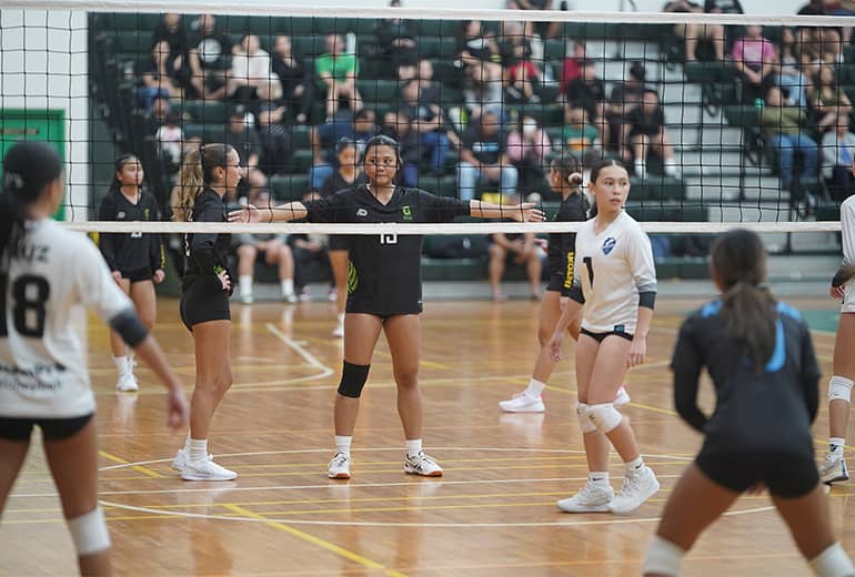 UOG Lady Tritons Volleyball League action photo from net height