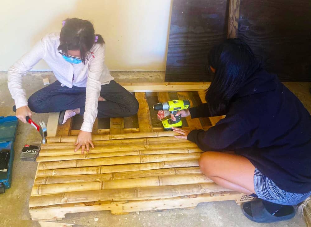 UOG Environmental Art students built their tree art installation using materials such as recycled bamboo and pine wood from Charter Day huts and local pallets.