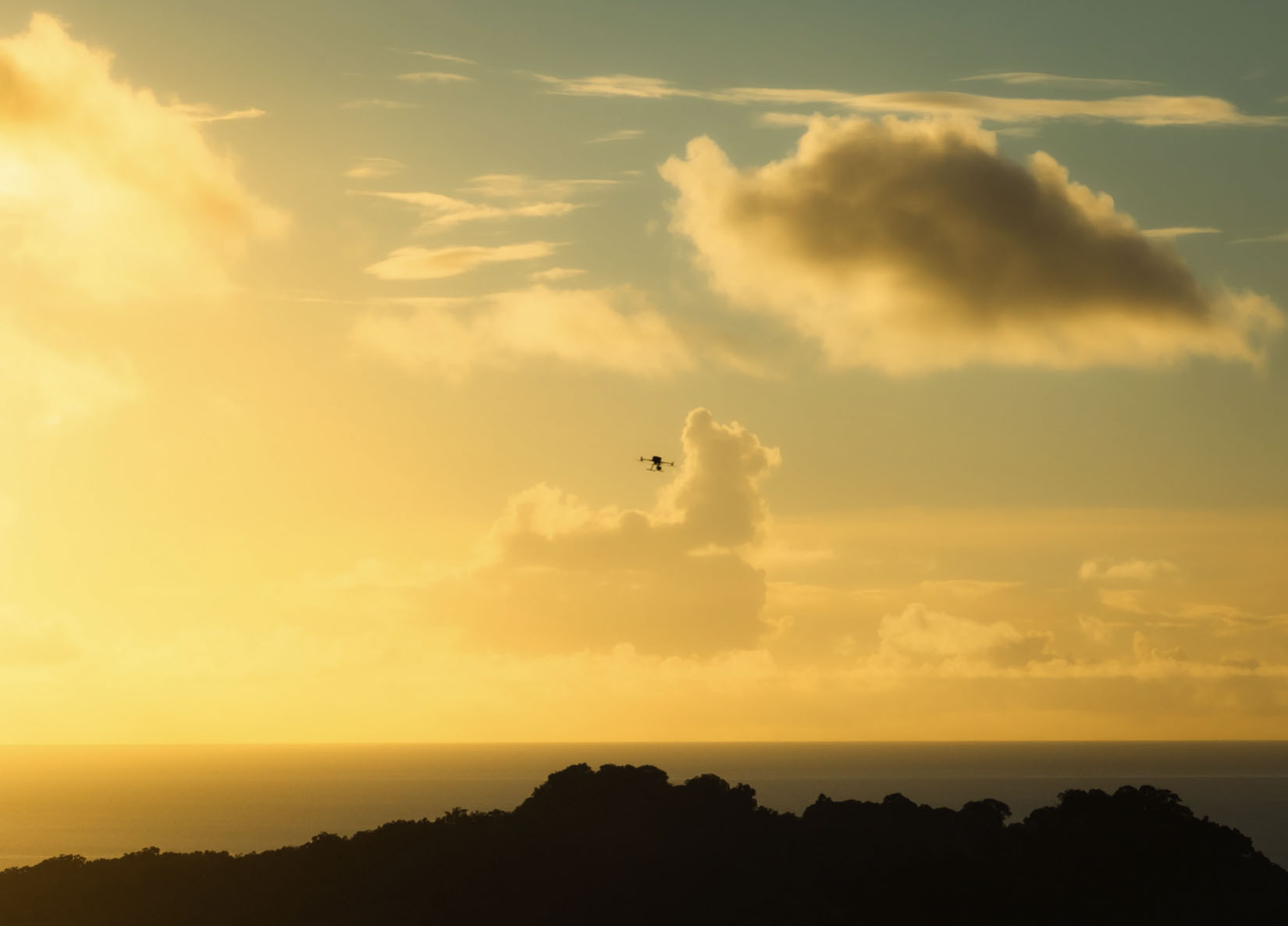 Image of drone flying over Palau during sunset