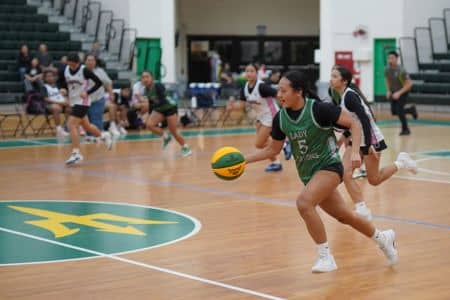 Lady Tritons playing basketball against Stingrays Black 