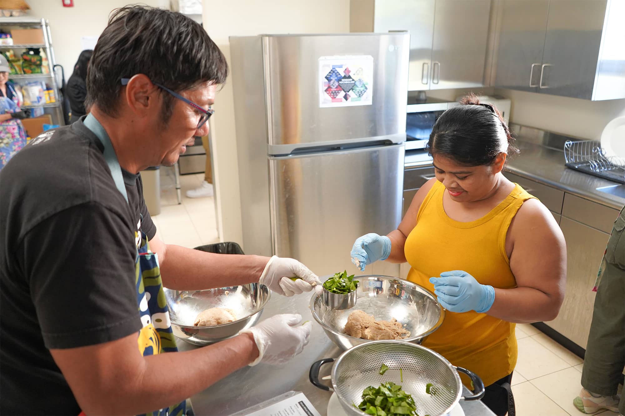Ricardo Balajadia, left, and Nida Pwekin work together to add local greens to a whole-wheat titiyas recipe during a UOG Extension cooking workshop in April. Starting May 27, UOG Extension will hold a first-time Garden-to-Table Workshop, focusing on how to grow high-yield, low-maintenance food plants in a residential setting and how to cook with them.