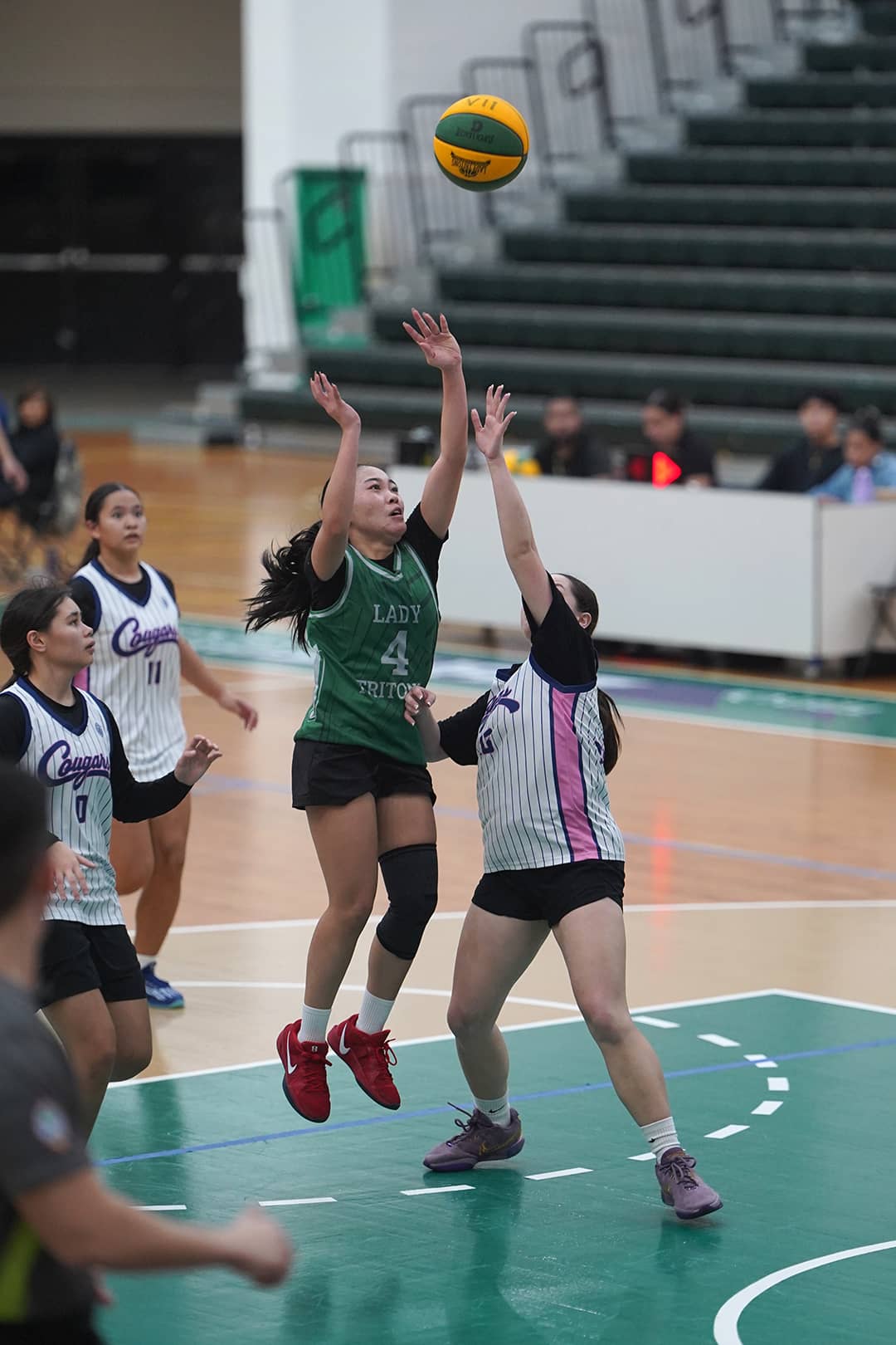 Lady Tritons playing basketball