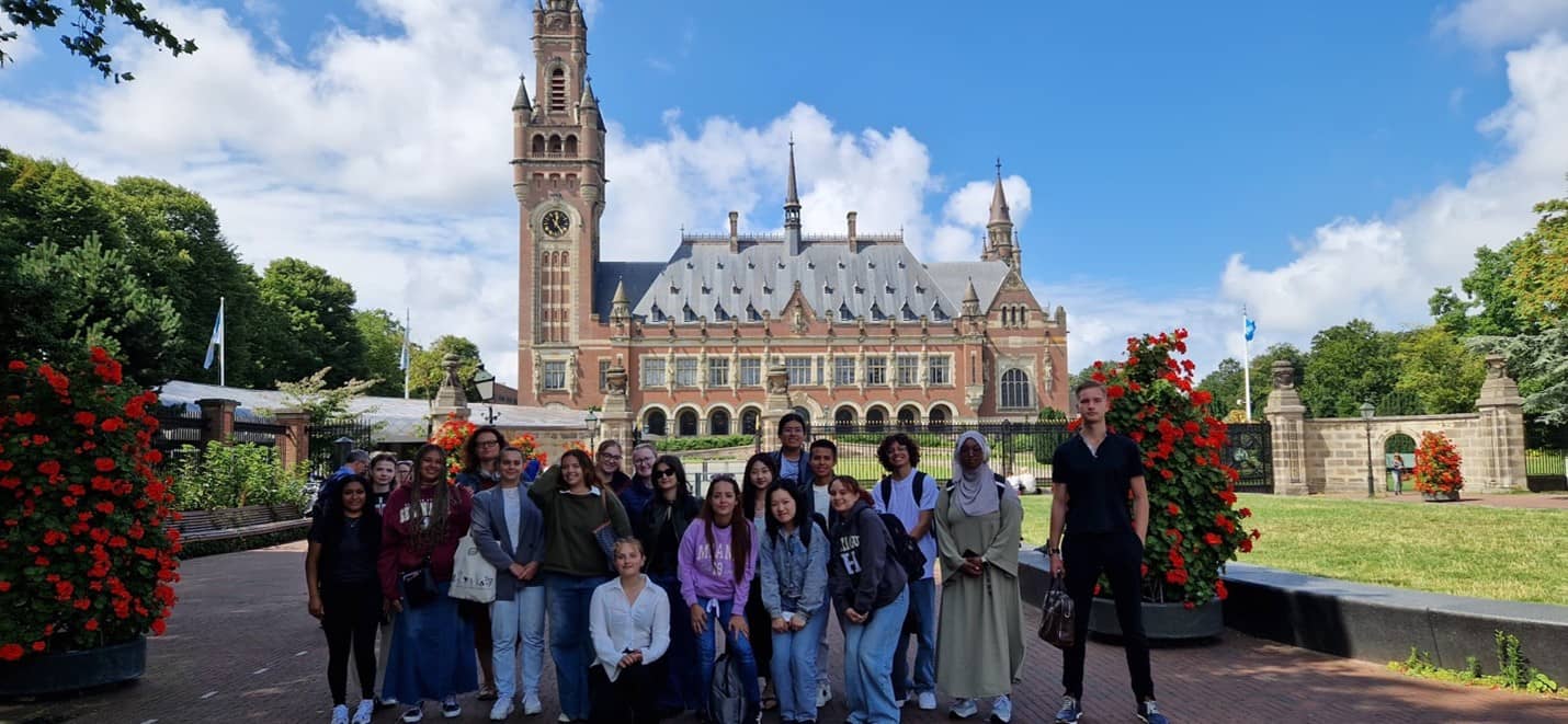 Tyra Delos Reyes joins her classmates for a photo in front of the International Court of Justice.