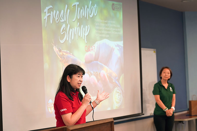 image of woman speaking into a microphone