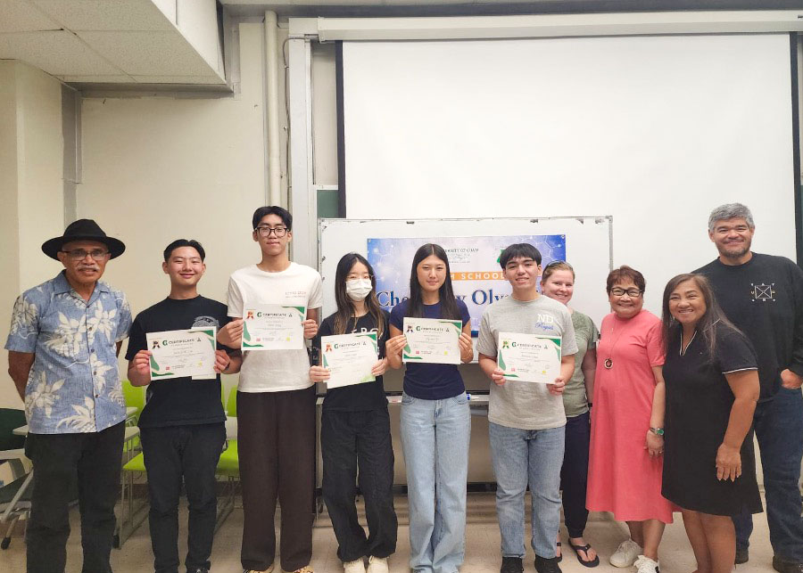 Winners of the 2025 UOG High School Chemistry Olympiad along with their teachers and UOG Chemistry Program faculty. (From left) Dr. Maika Vuki, interim associate dean (UOG’s College of Natural & Applied Sciences); Sean Lee (Saint John’s School); Allan Zeng (Saint John’s School); Sumin Kim (home schooled); Hannah Yo (Harvest Christian Academy); Antonio Cruz (Notre Dame High School), Ms. Ashley McNally, chemistry teacher (Harvest Christian Academy); Mrs. Evangeline Mangune, chemistry teacher (Father Duenas Memorial School); Mrs. Kay Artero, chemistry teacher (Notre Dame High School); and Dr. John F.K. Limtiaco, assistant professor of chemistry (UOG). Group of students holding certficates alongside teachers