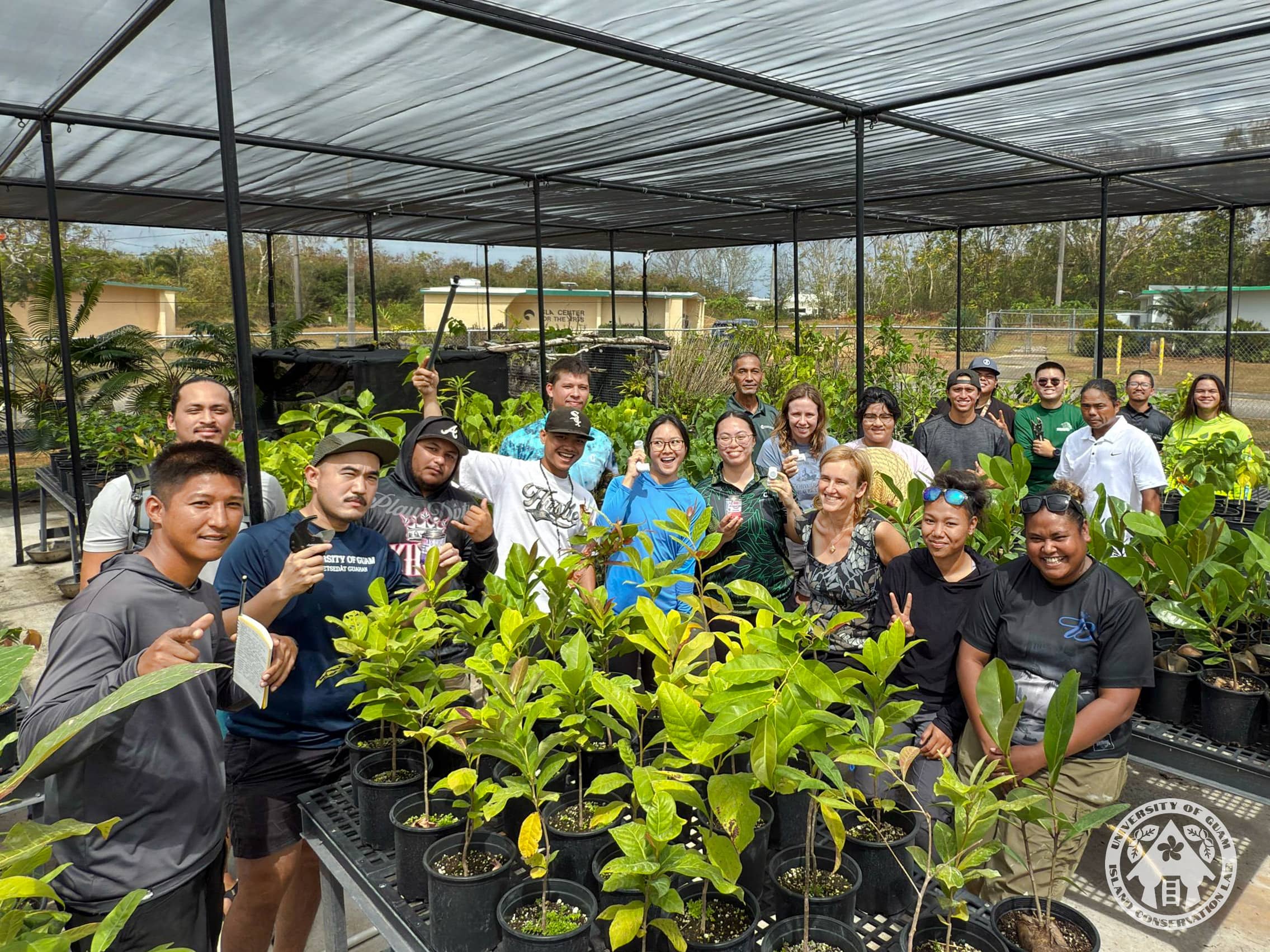 UOG Center for Island Sustainability staff take a group photo following an irrigation system training from UOG Cooperative Extension & Outreach agents Roland Quitugua and Joseph Tuquero. A group posing for a photo in a plant nursery