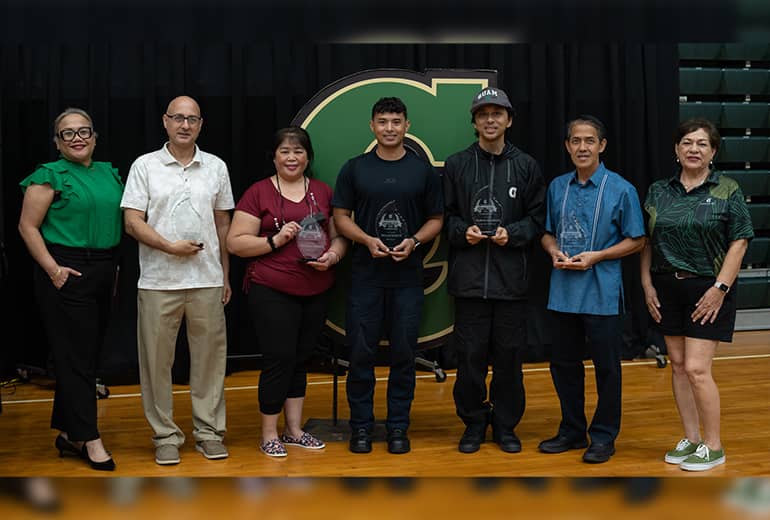 Newest Athletics Hall of Fame members take photos with admin and host