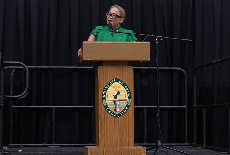 Kailey Quidachay reads Class of 2024 bios at podium