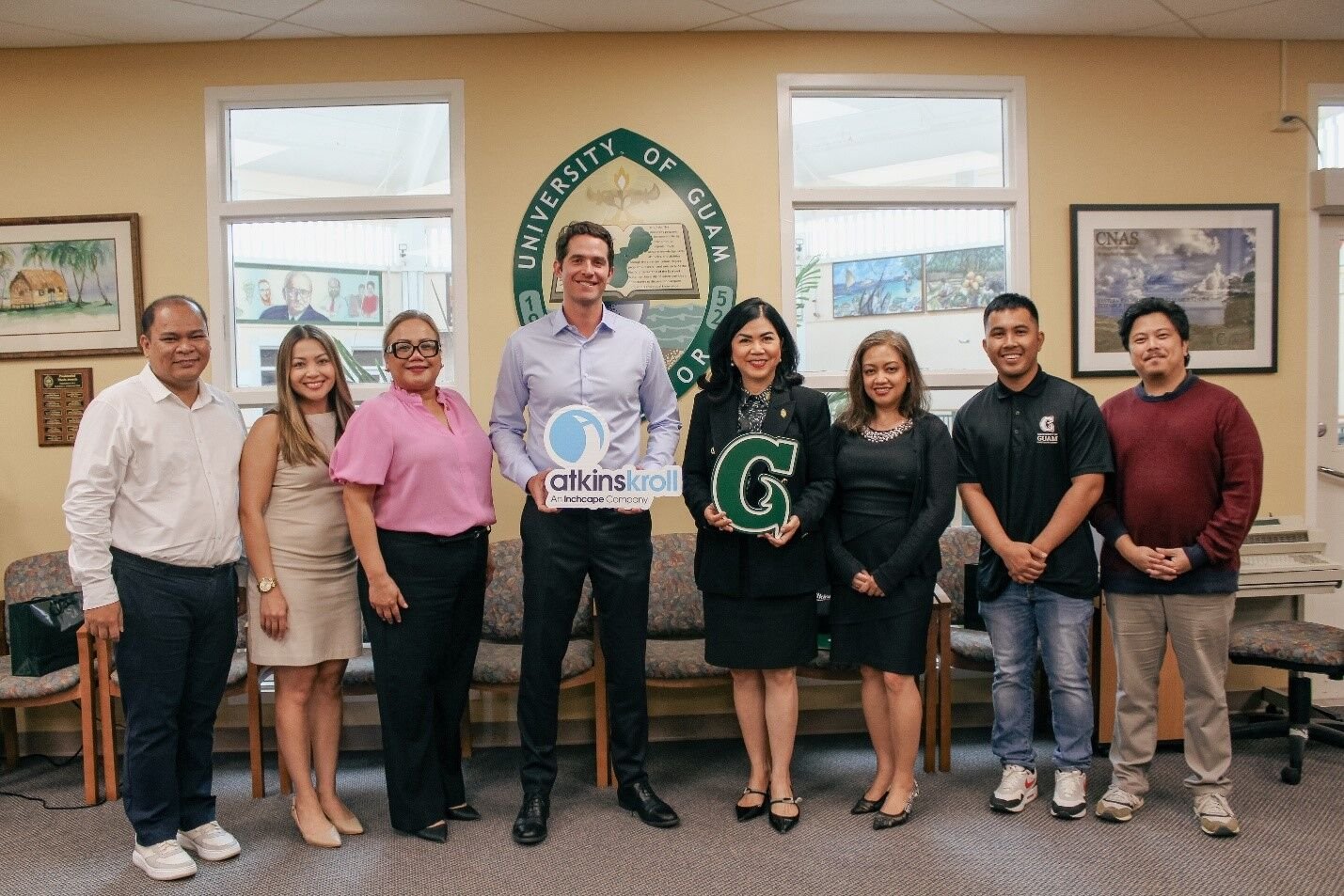 UOG and Atkins Kroll leaders pose together to mark new student partnership initiative.