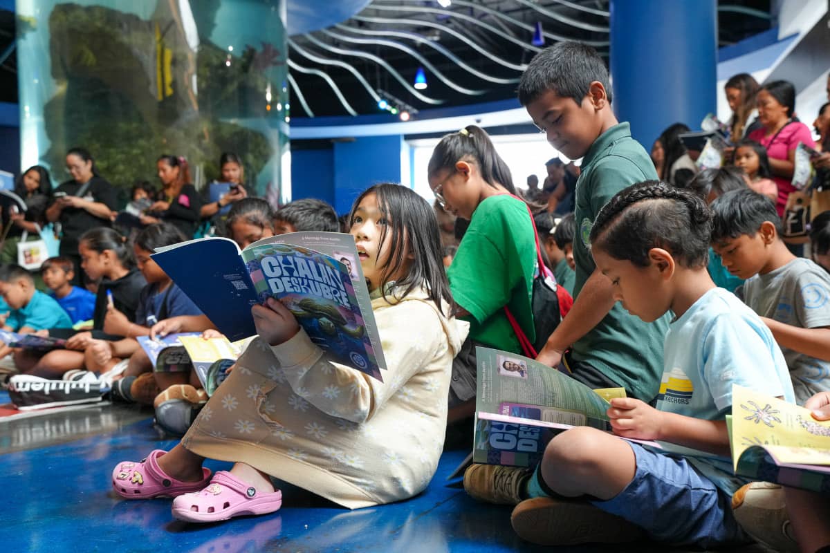 Elementary school student Naomi Grapa looks on as she peruses the latest issue of Guam’s only STEM magazine for kids