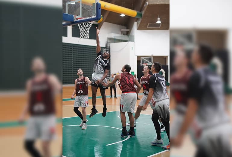 KFC Bombers team member shoots basketball