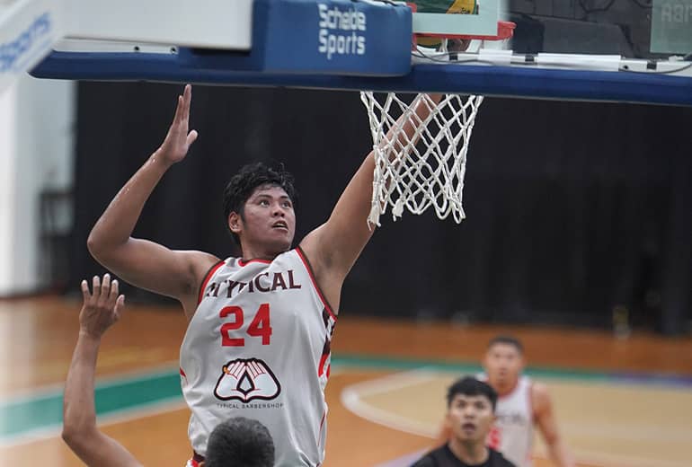 #24 basketball player shoots basketball into hoop