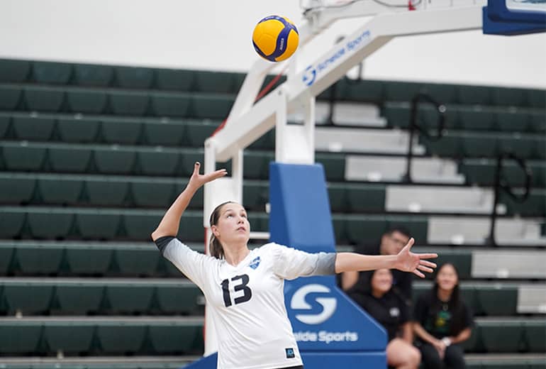 GuamPro1 volleyball player #13 spikes volleyball