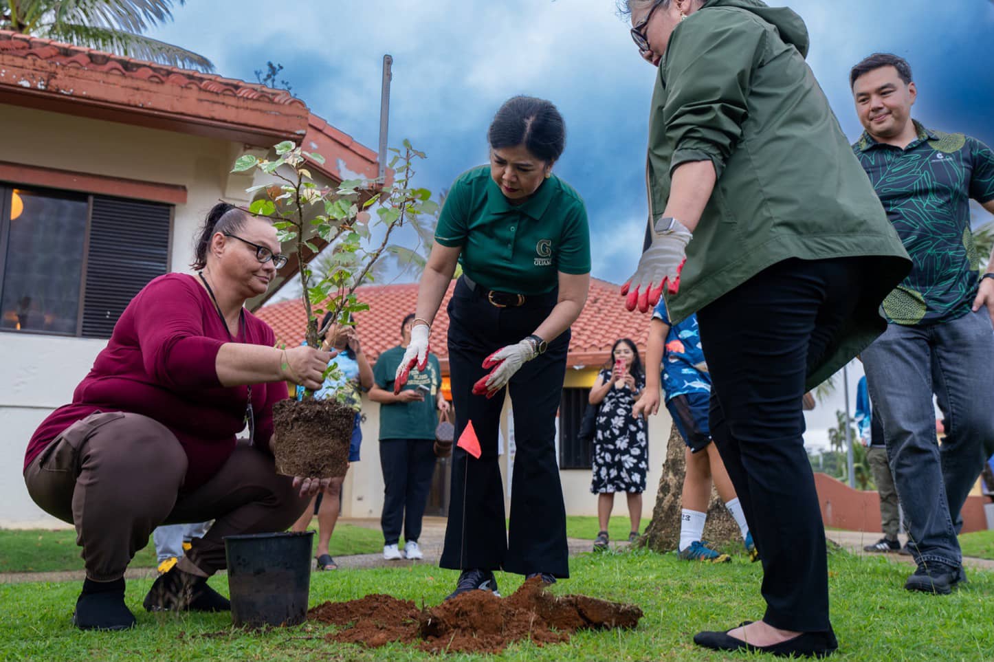 Planting a fruit tree at CHamoru Village