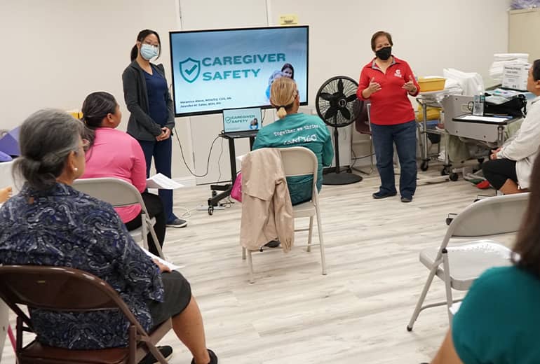 Veronica Alave presents to participants during in-person caregiver session