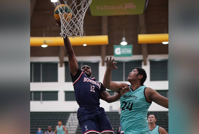 medium close up shot of kfc bomber jump shot while opponent tries to block