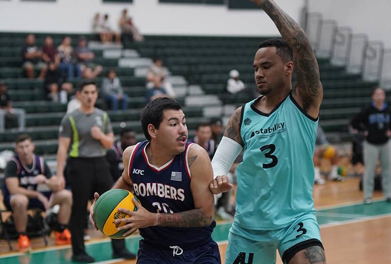 KFC bombers player protects ball from opponent