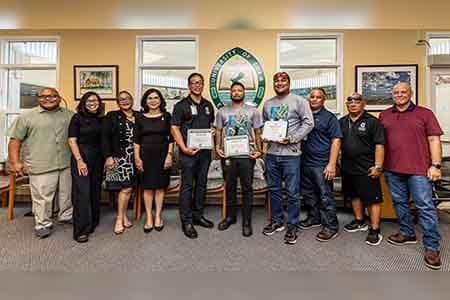 UOG president and admin pose for a photo with newly certified HVAC Journeymen