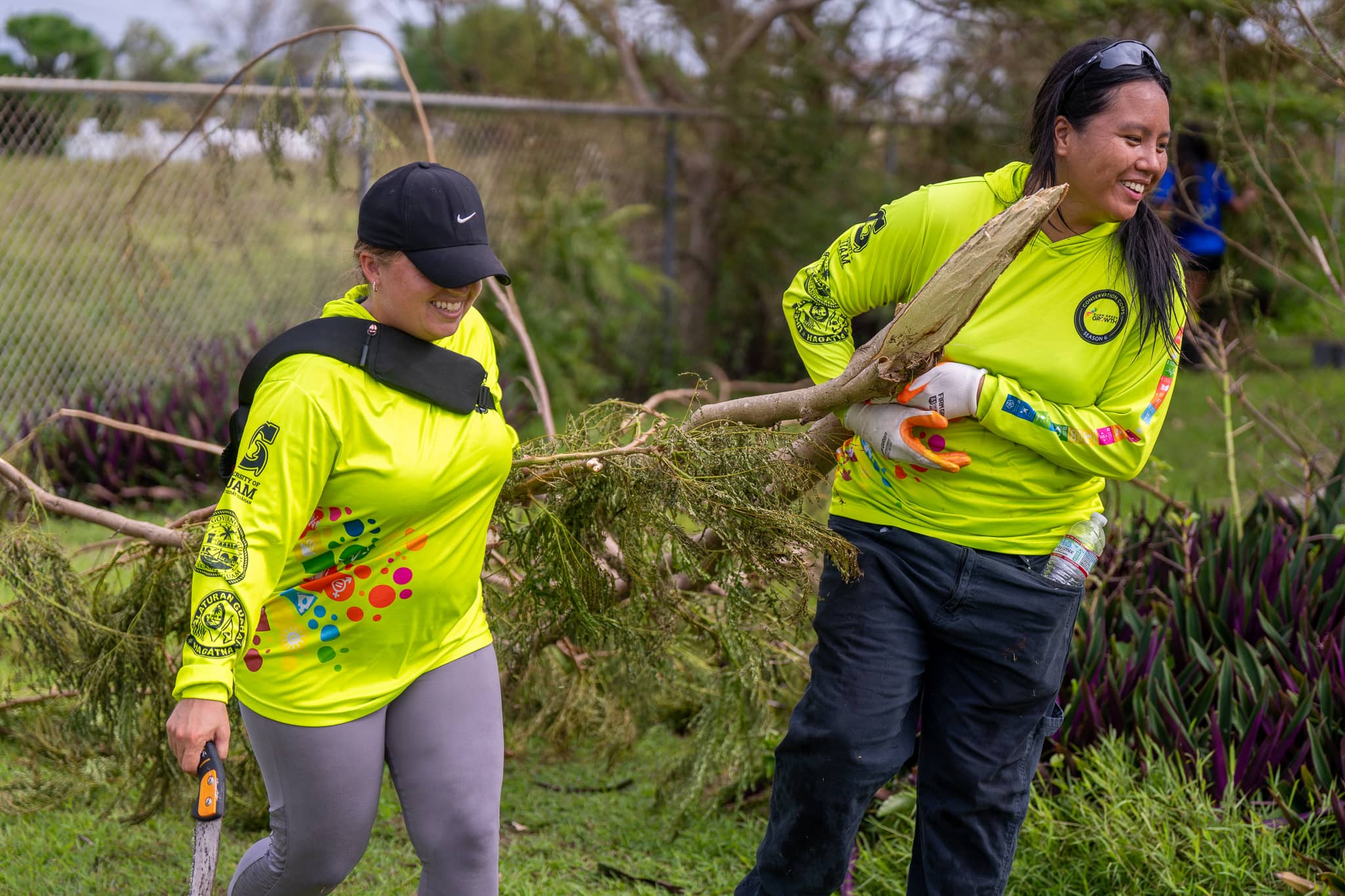 UOG Conservation Corps members clear tree debris on UOG campus