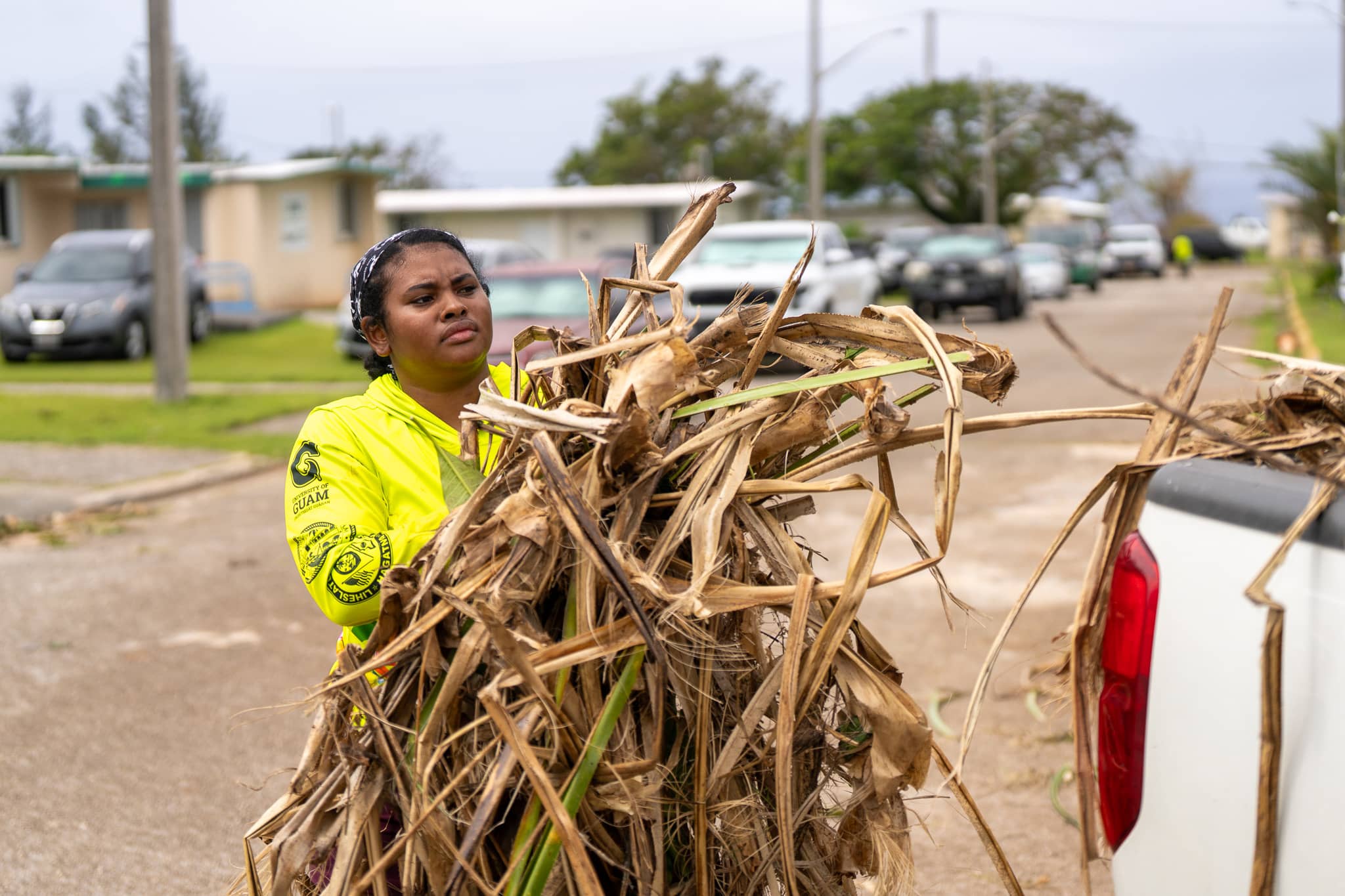 G3 Conservation Corps member loads tree debris into truck