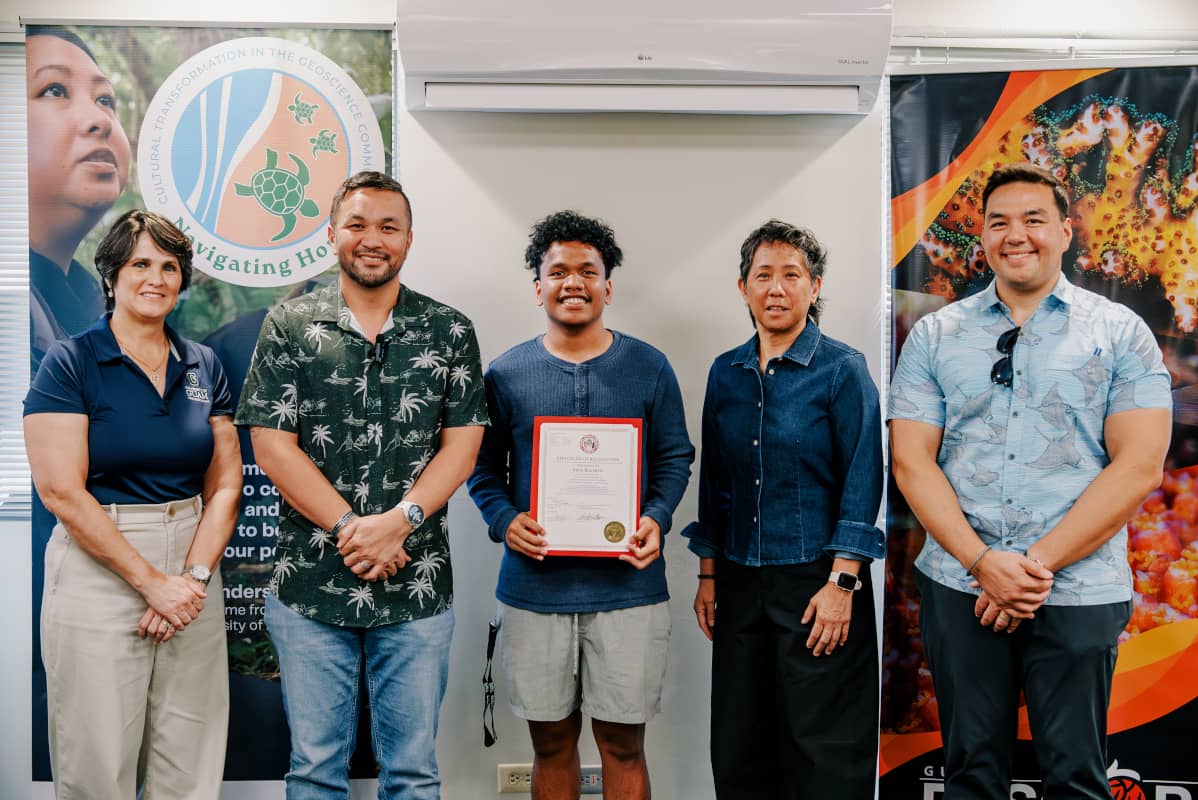 Student holding his Certificate