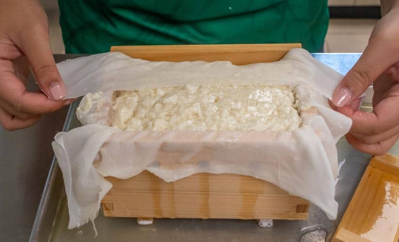 Soy curd in a wooden mold