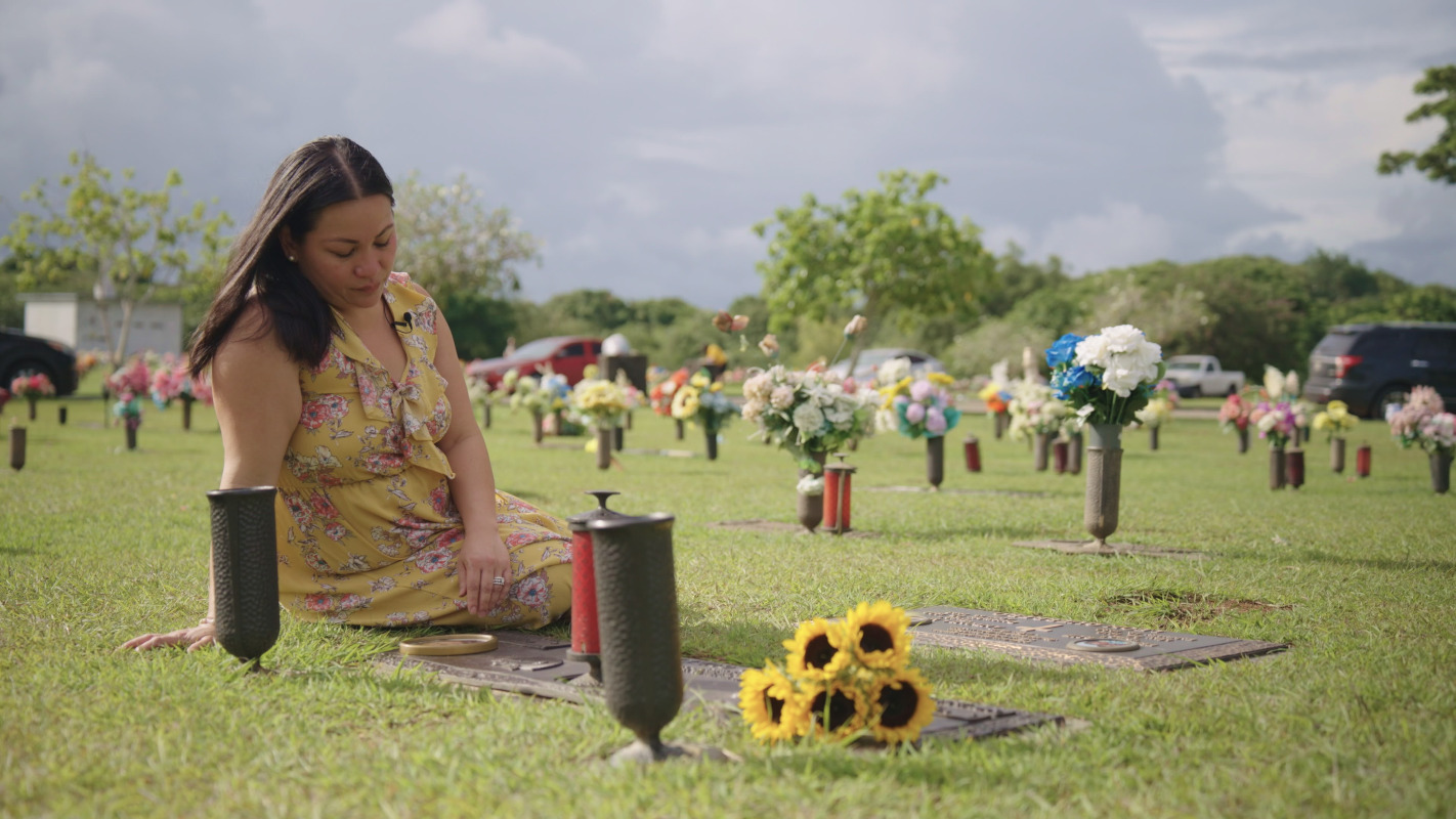 Women visiting sisters grave